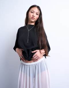 Model wearing Sheer maxi with lace inserts in ivory