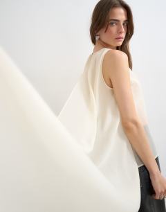 Model wearing Sheer organza drape tunic top in ecru