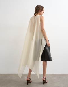 Model wearing Sheer organza drape tunic top in ecru