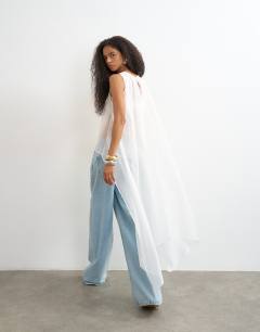 Model wearing Sheer organza drape tunic top in white