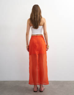 Model wearing Sheer organza maxi skirt in fiery orange