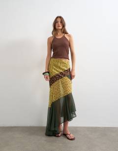 Model wearing Sheer panelled asymmetrical maxi skirt in green and brown spot