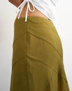 Model wearing Sheer panelled asymmetrical maxi skirt in green