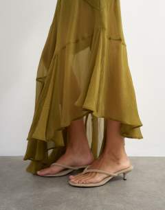Model wearing Sheer panelled asymmetrical maxi skirt in green