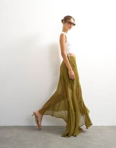 Model wearing Sheer panelled asymmetrical maxi skirt in green