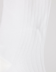 Model wearing Sheer ribbed sock in white