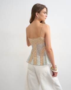 Model wearing Sheer seam detail cami top in spot