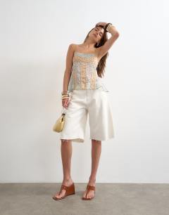 Model wearing Sheer seam detail cami top in spot