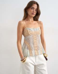 Model wearing Sheer seam detail cami top in spot