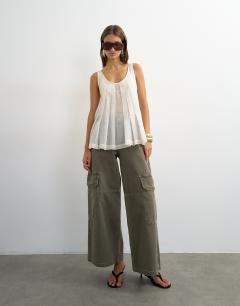 Model wearing Sheer sleeveless pintuck cami in white