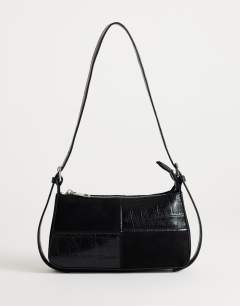 Model wearing Sherry small patchwork shoulder bag in black