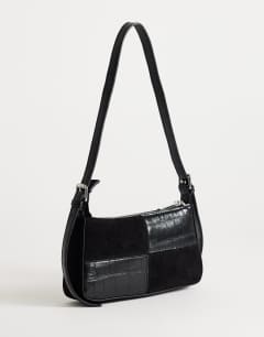 Model wearing Sherry small patchwork shoulder bag in black