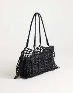 Model wearing Shia medium woven shoulder bag in black