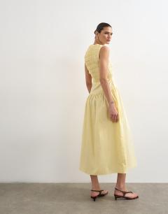 Model wearing Shirred bust dropped waist midi poplin dress in buttermilk