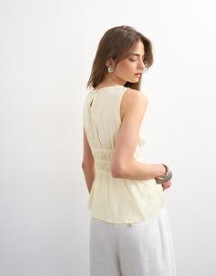 Model wearing Shirred detail sleeveless top in sand