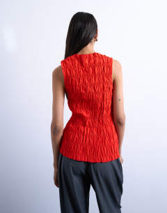 Model wearing Shirred tank top in red
