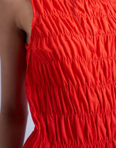 Model wearing Shirred tank top in red