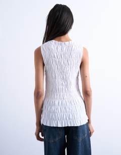 Model wearing Shirred tank top in white