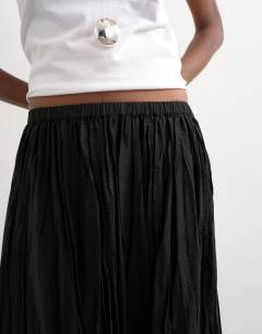 Model wearing Shirred waist crinkle full circle skirt in black