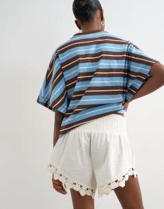 Model wearing Shirring detail knicker short in ecru