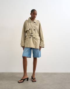 Model wearing Short belted mac in stone