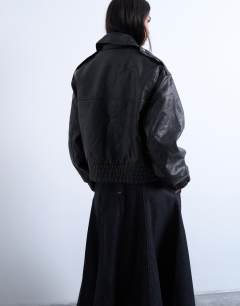 Model wearing Short bubble faux leather bomber jacket in black