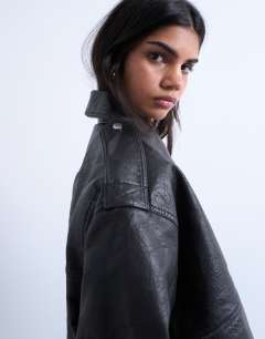 Model wearing Short bubble faux leather bomber jacket in black
