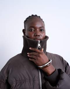 Model wearing Short rib collar puffer bomber jacket in chocolate