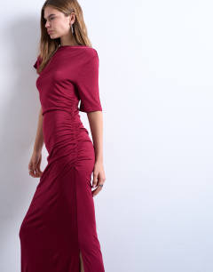 Model wearing Short sleeve asymmetric slinky maxi dress in red