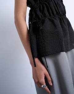 Model wearing Short sleeve channelled tie side top in black