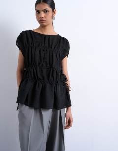 Model wearing Short sleeve channelled tie side top in black