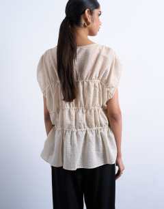 Model wearing Short sleeve channelled tie side top in ecru