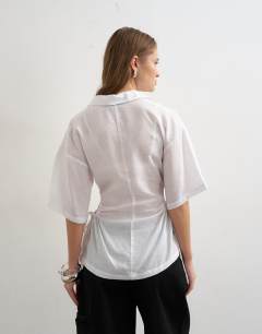 Model wearing Short sleeve fitted shirt with gathered waist in white