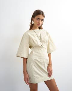 Model wearing Short sleeve slash neck structured mini dress in off white