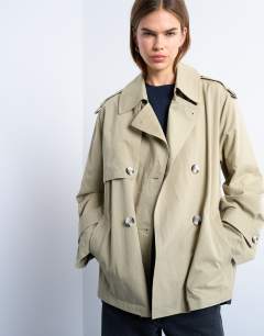 Model wearing Short trench coat in stone