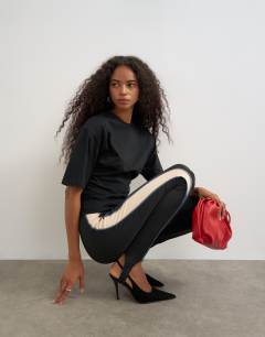 Model wearing Shoulder pad short sleeve t-shirt in black