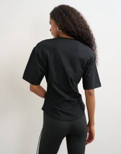Model wearing Shoulder pad short sleeve t-shirt in black