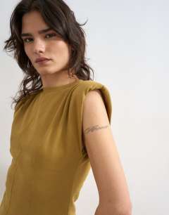 Model wearing Shoulder pad sleeveless maxi dress in olive