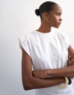 Model wearing Shoulder pad t-shirt in white