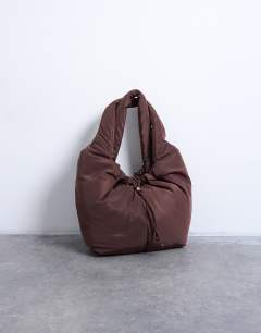 Model wearing Sia ruched nylon shoulder bag in chocolate