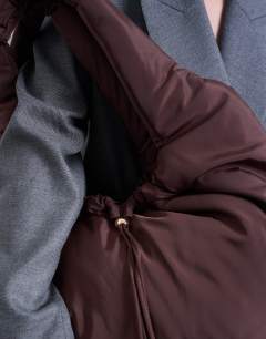 Model wearing Sia ruched nylon shoulder bag in chocolate