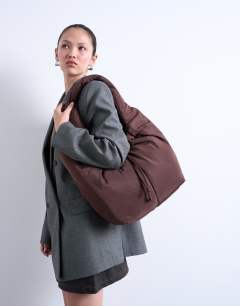 Model wearing Sia ruched nylon shoulder bag in chocolate