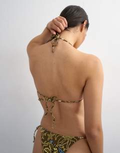 Model wearing Sicily triangle bikini top in chocolate print