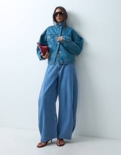 Model wearing Side pleat cocoon jean in bleach