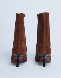 Model wearing Sienna Premium leather square toe mid heel boot in tan