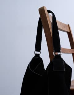 Model wearing Sienna real leather shoulder bag in black