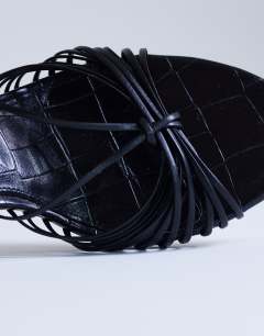 Model wearing Simba strappy mule high sandal in black