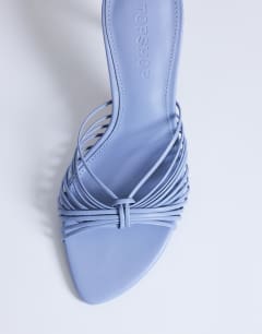 Model wearing Simba strappy mule high sandal in blue