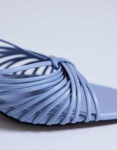 Model wearing Simba strappy mule high sandal in blue