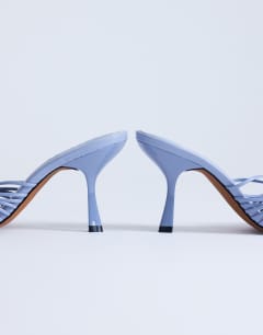 Model wearing Simba strappy mule high sandal in blue